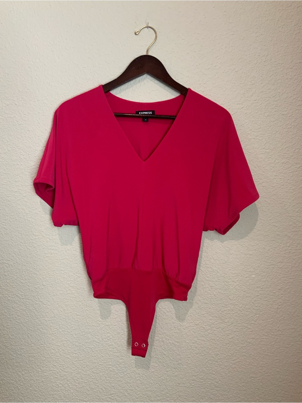 Size extra small hit pink Express bodysuit